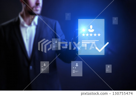 Expert evaluating digital reviews and ratings in a modern virtual interface during evening hours 130755474