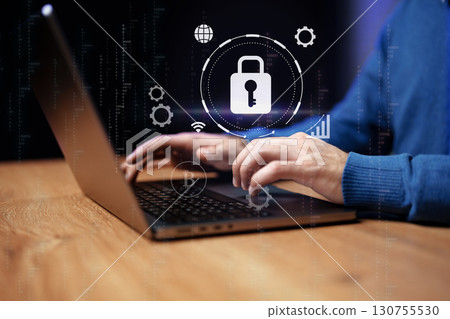 Professional man presenting a digital pad with security symbols in a high-tech environment Professional man presenting a digital pad with security symbols in a high-tech environment 130755530
