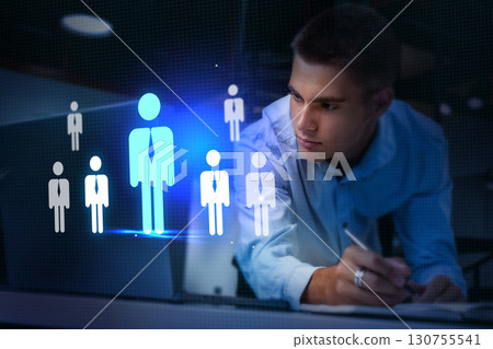 Innovative professional analyzing data and trends using technology in a modern workspace Innovative professional analyzing data and trends using technology in a modern workspace 130755541