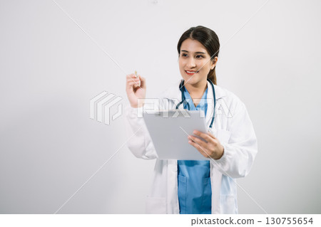 Muslim Arab person. The face of a female doctor on an isolated white background. 130755654
