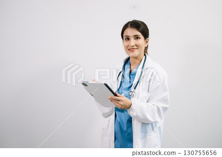 Muslim Arab person. The face of a female doctor on an isolated white background. Muslim Arab person. The face of a female doctor on an isolated white background. 130755656