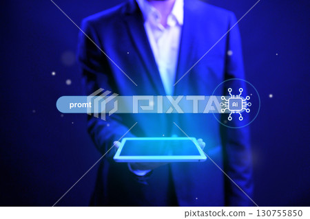 Business professional holding a tablet with futuristic digital interface in dark environment shows advanced technology trends 130755850