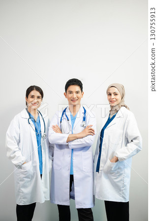 Successful team of medical doctors looking at camera and smiling while standin. Health, professional and people team 130755913