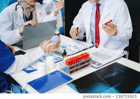 Medical technology network team meeting concept. Doctor hand working with smart phone modern digital tablet and laptop computer 130755923