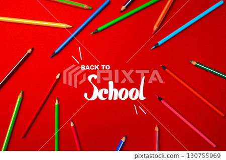Colorful pencils surround the phrase back to school on a bright red background, capturing the excitement of a new academic year 130755969
