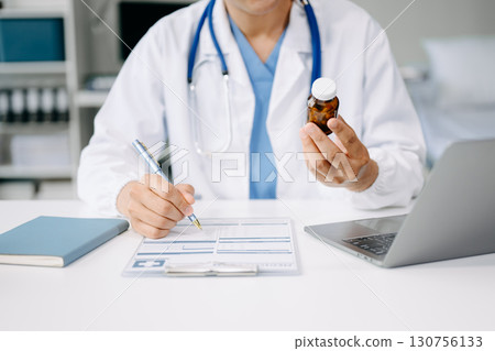Doctors explain the use of medication to patients. healthcare and medical concept. 130756133