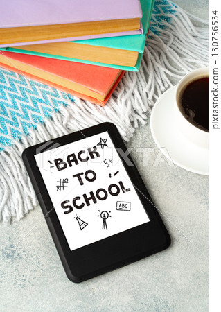 Back to school preparation with books, a digital tablet, and coffee on a cozy table Back to school preparation with books, a digital tablet, and coffee on a cozy table 130756534