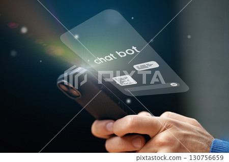 User interacting with a virtual chat bot on a smartphone screen during evening hours User interacting with a virtual chat bot on a smartphone screen during evening hours 130756659