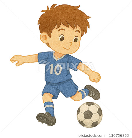 A cheerful boy playing soccer, showcasing joy and activity in sports. 130756863