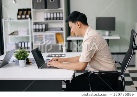Group of professionals in an office discussing strategy, analyzing data, and collaborating on projects Group of professionals in an office discussing strategy, analyzing data, and collaborating on projects 130756899