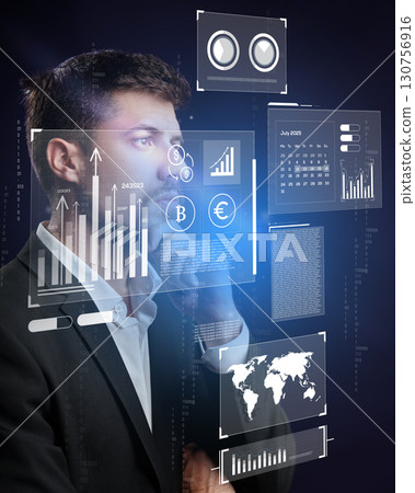 Business professional analyzing financial data with digital interfaces in a modern office environment 130756916