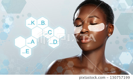 Woman enjoying a skincare treatment with under-eye patches, relaxed in studio with blue backdrop Woman enjoying a skincare treatment with under-eye patches, relaxed in studio with blue backdrop 130757199