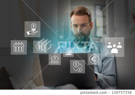 Man engaged in online financial activities while working from home during daytime 130757356