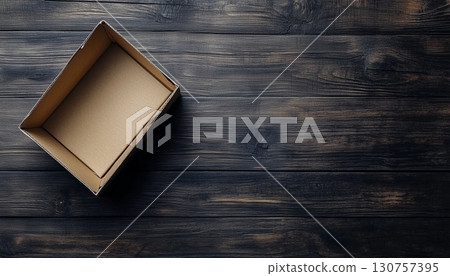 Flat lay brown empty open cardboard box carton package for packing copy space wooden background 130757395