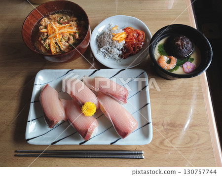 Japanese yellowtail sushi Edomae nigiri sushi (all winter yellowtail), with chawanmushi Japanese yellowtail sushi Edomae nigiri sushi (all winter yellowtail), with chawanmushi 130757744