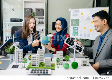 Business people having consultation about wind energy at company office. Business team discussing about windmill and alternative green enery. Executive meeting 130757746