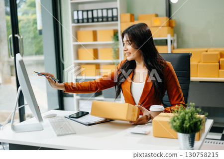 Startup small business SME, Entrepreneur owner woman using smartphone or tablet taking receive and checking 130758215