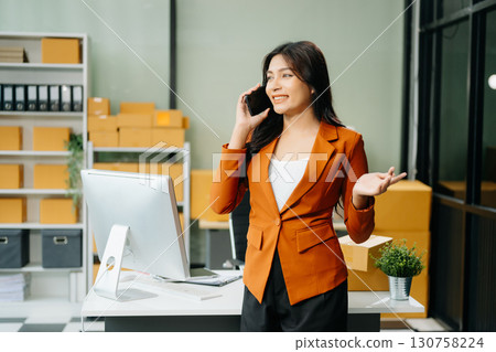 Startup small business SME, Entrepreneur owner woman using smartphone or tablet taking receive and checking 130758224