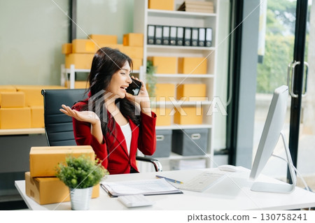 Startup small business SME, Entrepreneur owner woman using smartphone or tablet taking receive and checking 130758241