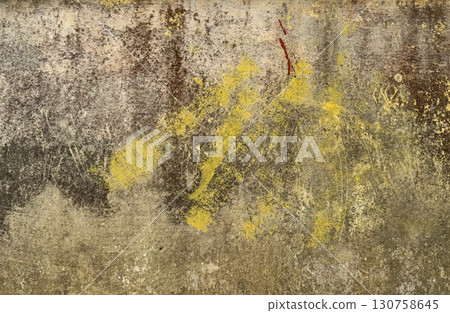 Grunge old wall texture with yellow paint stains and weathered surface 130758645