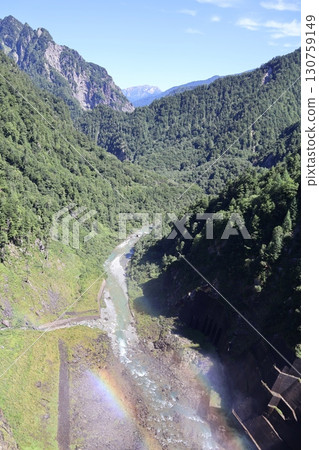 A rainbow over the Kurobe River seen from the Kurobe Dam 130759149