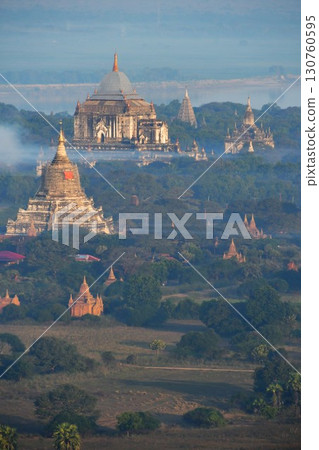 Myanmar, Bagan, view from a hot air balloon, Shwesandaw Pagoda, Thatbyinnyu Temple, pagodas in the morning mist Myanmar, Bagan, view from a hot air balloon, Shwesandaw Pagoda, Thatbyinnyu Temple, pagodas in the morning mist 130760595