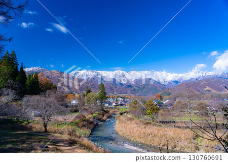 [Autumn Material] Three-tiered autumn foliage scenery seen from Oide Park in Hakuba Village in autumn [Nagano Prefecture] 130760691