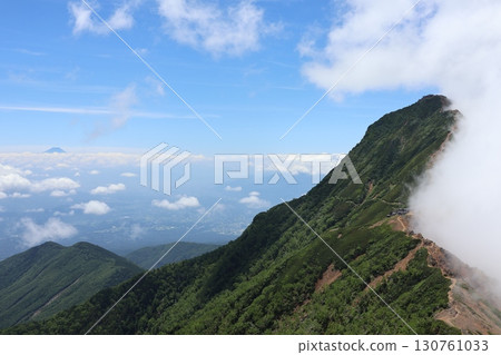 Mount Akagi, half covered in clouds, and Mount Fuji seen from afar Mount Akagi, half covered in clouds, and Mount Fuji seen from afar 130761033