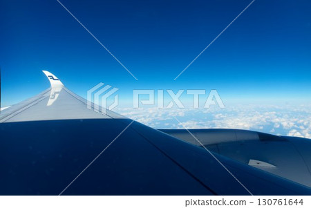 The blue sky seen from the window of the plane 130761644