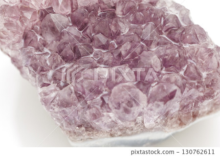 Amethyst cluster on a white background Amethyst cluster on a white background 130762611