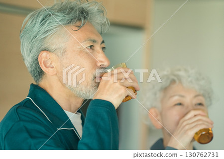 Elderly couple drinking water in the morning Elderly couple drinking water in the morning 130762731
