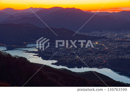 Night view of Lake Kawaguchi from Mount Setsugatake in the Misaka Mountains and the Doshi and Tanzawa mountain ranges at dawn Night view of Lake Kawaguchi from Mount Setsugatake in the Misaka Mountains and the Doshi and Tanzawa mountain ranges at dawn 130763599