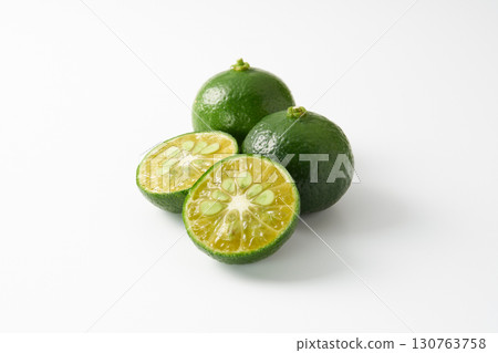 Green sliced Shikuwasa on a white background Green sliced Shikuwasa on a white background 130763758
