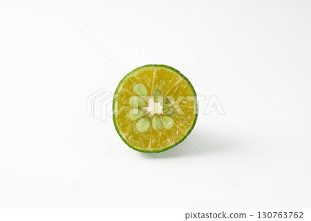 Green sliced Shikuwasa on a white background Green sliced Shikuwasa on a white background 130763762