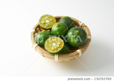 Green sliced Shikuwasa on a white background Green sliced Shikuwasa on a white background 130763769