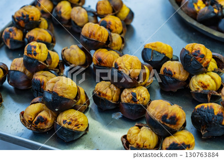 Fresh fried chestnuts on the streets of Istanbul. Turkish street food. Fast food. National cuisine Fresh fried chestnuts on the streets of Istanbul. Turkish street food. Fast food. National cuisine 130763884