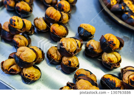 Fresh fried chestnuts on the streets of Istanbul. Turkish street food. Fast food. National cuisine 130763886