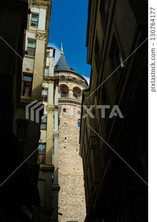Istanbul, Turkey. View of Galata tower through the streets with tight buildings. Travel attraction. Islamic architecture 130764177