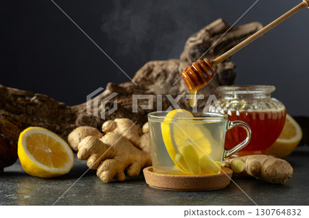 Ginger tea with lemon and honey. 130764832