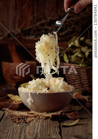 Traditional German sauerkraut on a old rustic wooden table. 130764841