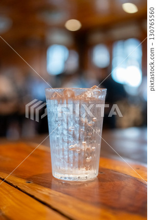 A glass of iced water on the table 130765560