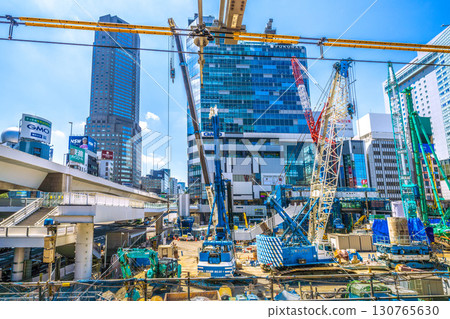 Tokyo cityscape, Japan, August 19th. Huge heavy machinery such as crawler cranes and pile drivers are lined up... = Shibuya Tokyo cityscape, Japan, August 19th. Huge heavy machinery such as crawler cranes and pile drivers are lined up... = Shibuya 130765630