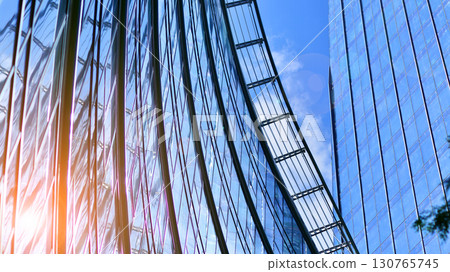 Modern sustainable glass office buildings. Exterior view of corporate headquarters glass buildings architecture.Glass windows in energy-efficient buildings. Financial business center buildings. Modern sustainable glass office buildings. Exterior view of corporate headquarters glass buildings architecture.Glass windows in energy-efficient buildings. Financial business center buildings. 130765745