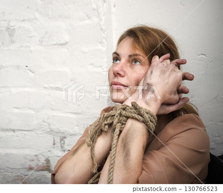 Young pretty sad bounded girl 130766523