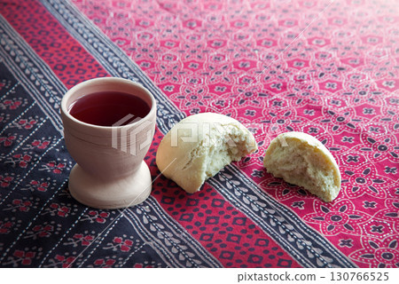 Wine in a gobled and bread 130766525