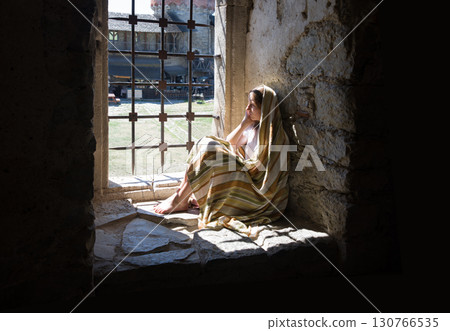 Lone girl sitting in the castle Lone girl sitting in the castle 130766535