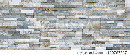 Modern stone cladding creating a textured wall background Modern stone cladding creating a textured wall background 130767827