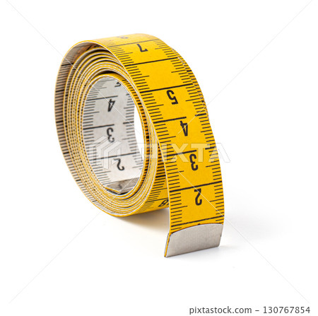 Yellow measuring tape curled up on white background 130767854