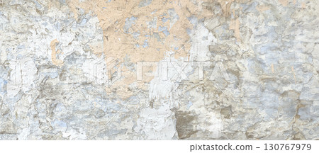 Weathered wall showing layers of cracking paint and plaster 130767979