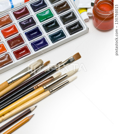 Painting equipment arranged neatly on white surface with copy space 130768015
